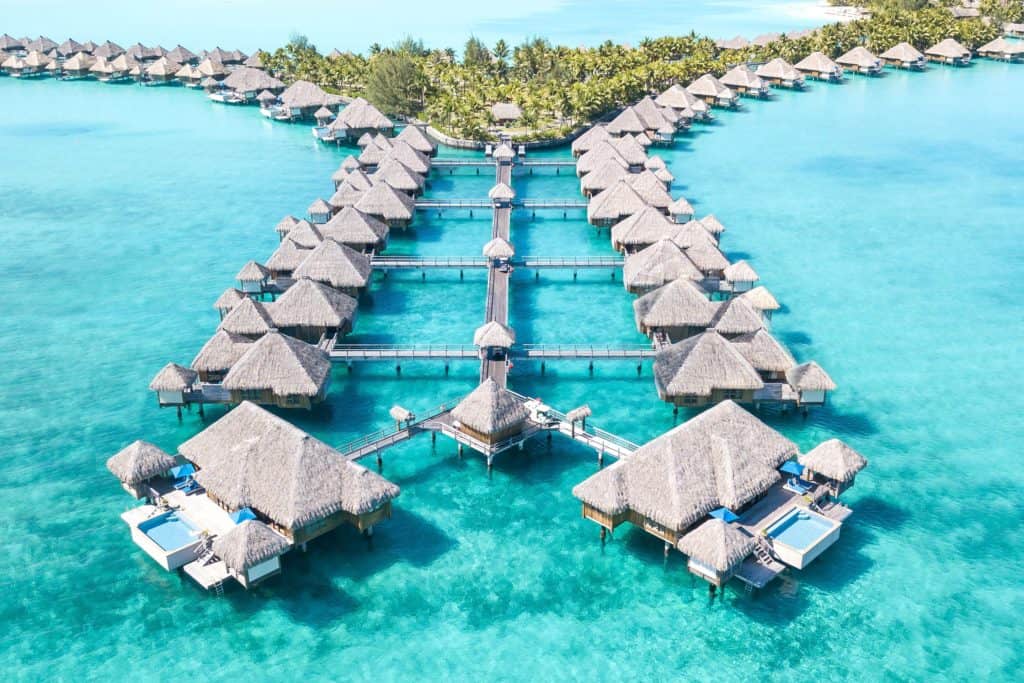 an aerial photo of the over water bungalows in bora bora
