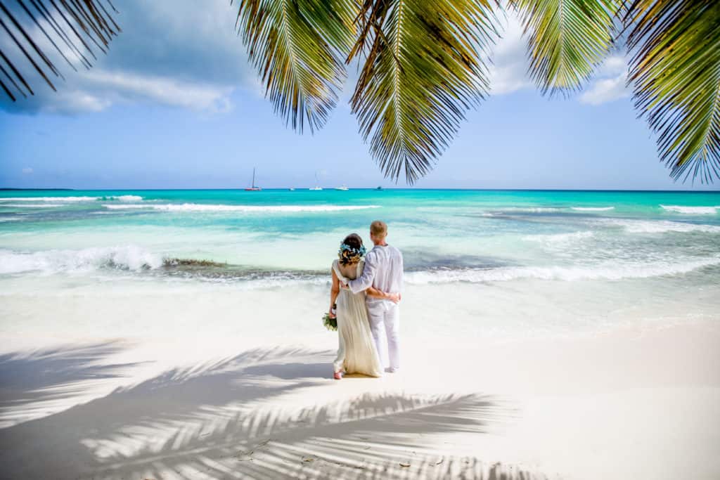 a couple on the beach during their honeymoon.