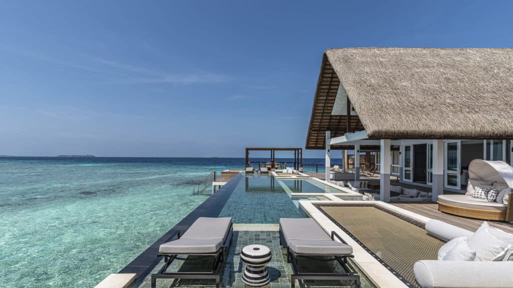 the overwater honeymoon villas at the four seasons resort maldives